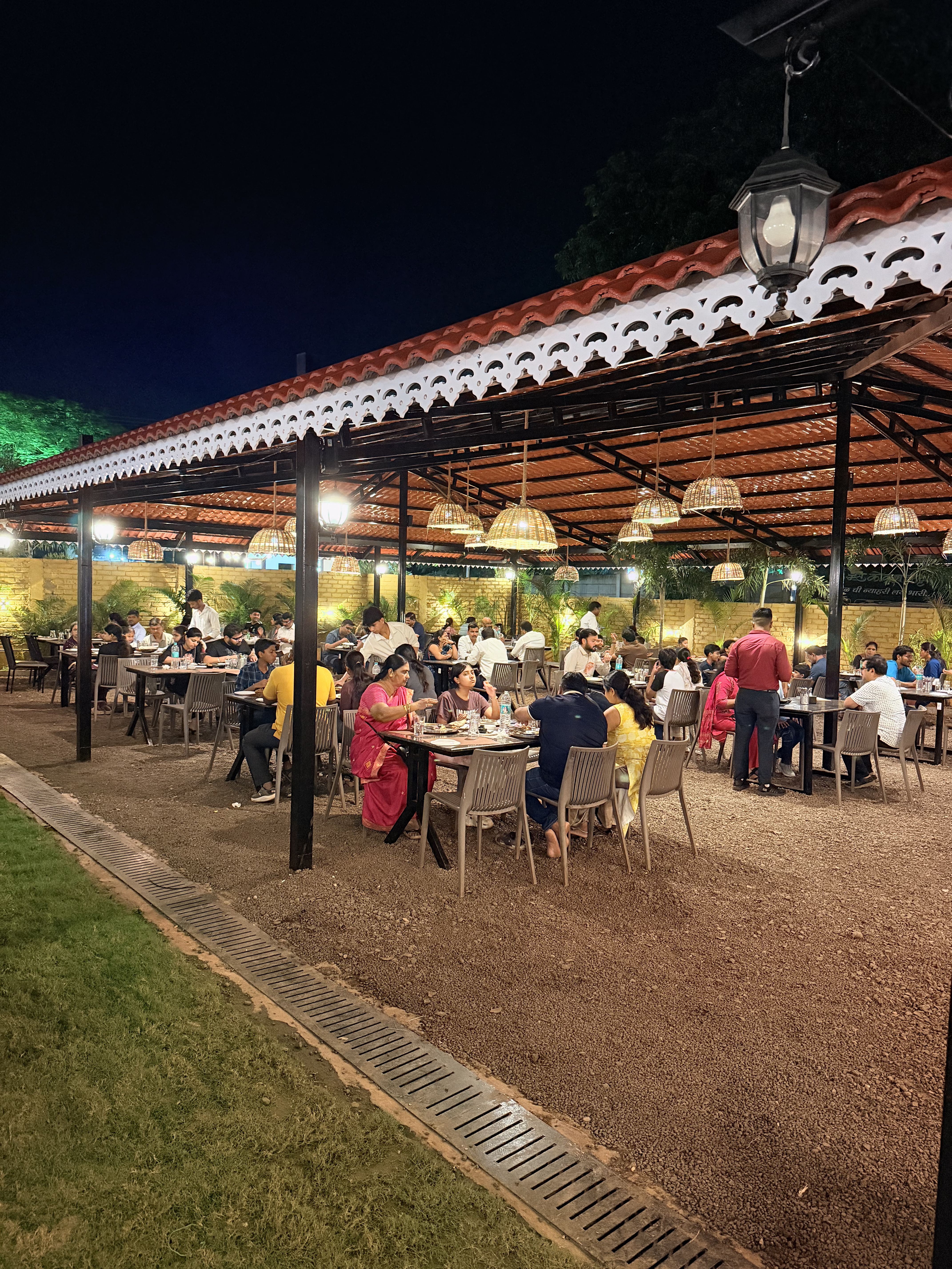 Warmly lit outdoor dining ambience