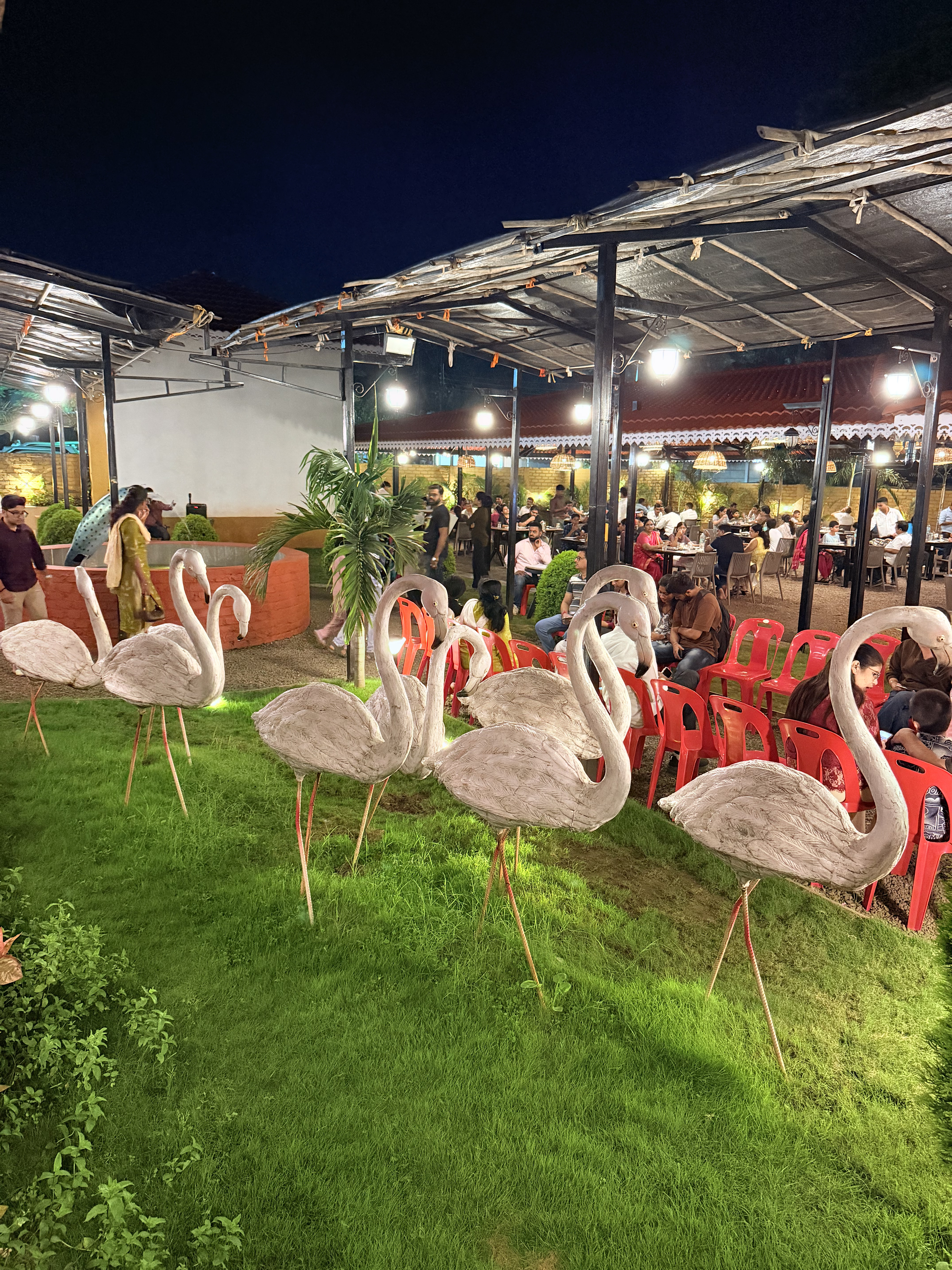 Garden seating and decorative flamingos